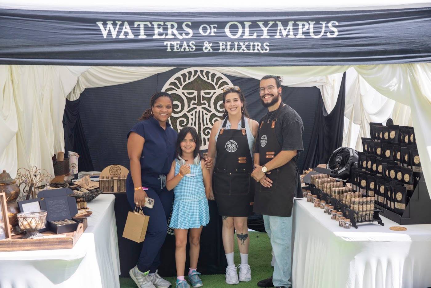 The Waters of Olympus booth at WOW